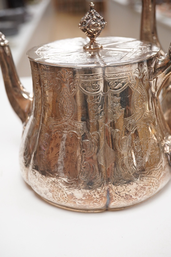 A Victorian engraved silver teapot and matching coffee pot, by George Ivory, London, 1857, gross weight 46.2oz. CITES Submission reference 4K2AZFRW. Condition - fair to good